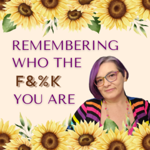 Kat - woman with short purple hair, glasses, and rainbow top with the words Remembering Who The F%&K You Are
